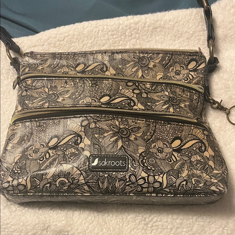 Sakroots Black and Cream Floral Crossbody Bag